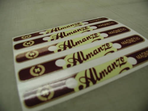A sheet of professionally printed custom stickers showcasing the “Almanzo” logo. Ideal for branding, giveaways, or promotional labeling with a bold, retro look.